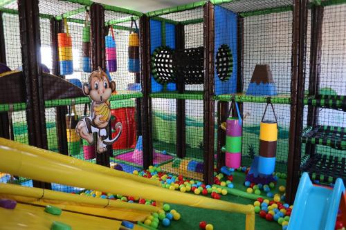 a monkey in a cage in a playground at Hotel Prestige Agadir Boutique & SPA in Agadir