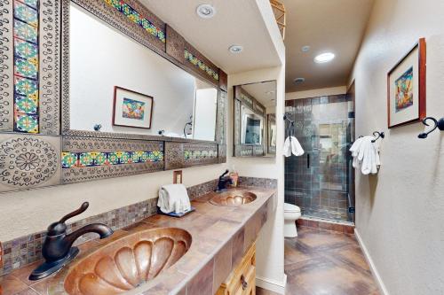 a bathroom with a large sink and a shower at Camino los Mochis in Tucson