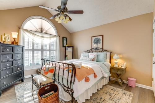 a bedroom with a bed and a ceiling fan at Cozy Buford Home with Piano about Mins to Lake Lanier! in Buford