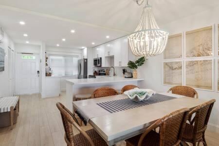 a kitchen and dining room with a table and chairs at La Brisa Unit 105 North Building in Key West