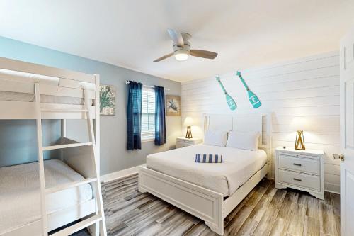 a bedroom with a bunk bed and a ladder at Panhandle Luxury D in Panama City Beach