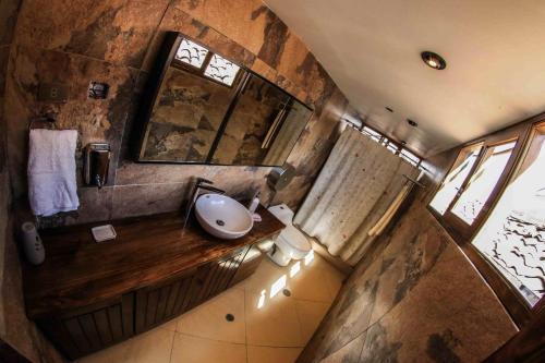 an overhead view of a bathroom with a sink at Bamba House Cusco in Cusco