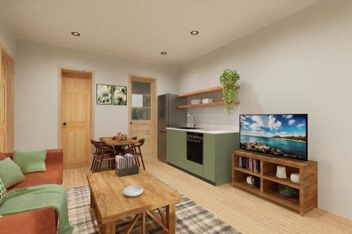een woonkamer met een bank, een tv en een tafel bij Squam waterfront 2 bed 2bath (Suite 8) in Holderness