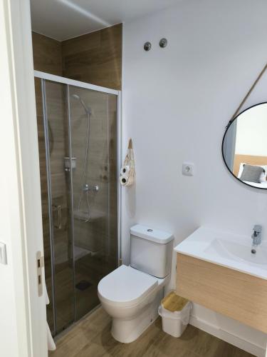 a bathroom with a toilet and a shower and a sink at Suitel Pombal in Pombal