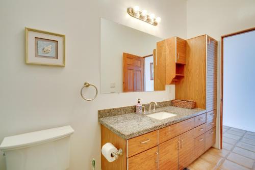 a bathroom with a sink and a toilet at Waianae Beach House with Direct Coast Access and Views in Waianae