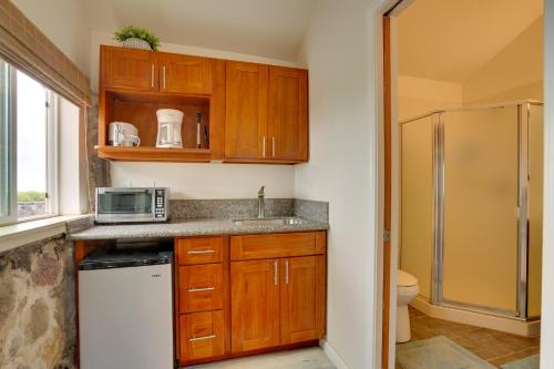 A kitchen or kitchenette at Lava Rock Beach House in Waianae with Private Pool