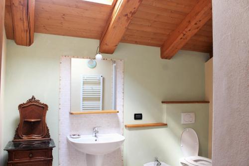 a bathroom with a sink and a toilet at Ca' 'd Carlot in Cantarana