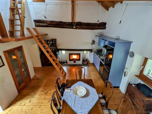 an overhead view of a room with a table and a kitchen at Wild Valley Natura Pura in Valle Onsernone in Crana