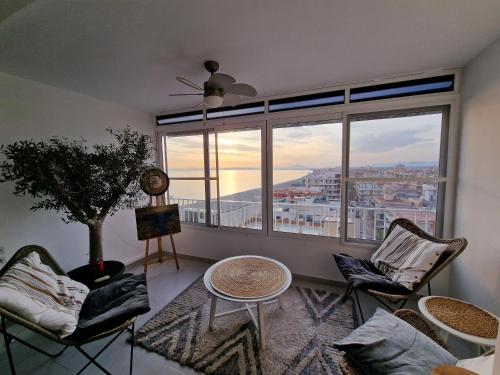 a living room with a large window with a view at Sunset 8F in Santa Pola