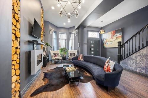 a living room with a couch and a table at McCormick Place Guest House in Chicago