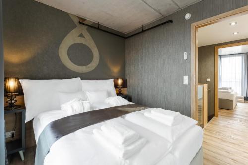 a bedroom with a large white bed in it at Onyx Luxury Budapest in Budapest