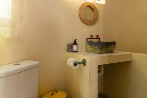 a bathroom with a toilet and a sink at Pacific Villa Punta Mita-Playa Careyeros in Punta Mita