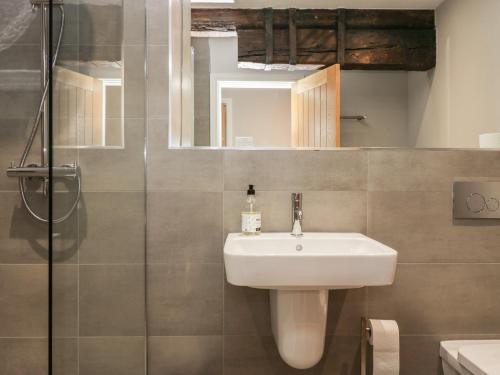 a bathroom with a sink and a shower at Helton Fell in Kendal