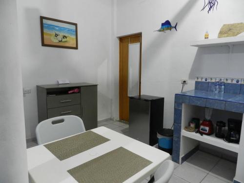 a room with a table and a desk and a table and chair at Casa Kayack in San Carlos