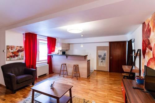 a living room with a couch and a table at Rezident in Bucharest