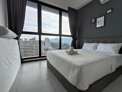 Voodi või voodid majutusasutuse New 2BR / 3BR Serenity Homestay @ Urban Suite toas