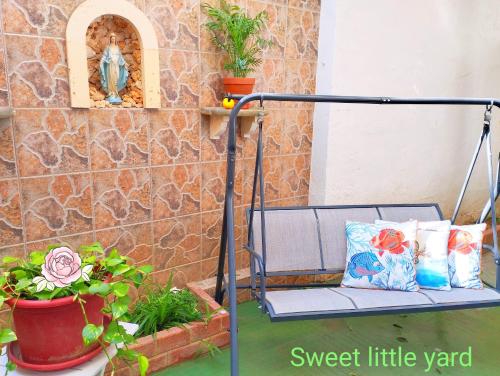 a bench on the porch of a house at "Spirit of Malta" Historic Maltese Townhouse by the sea in Sliema