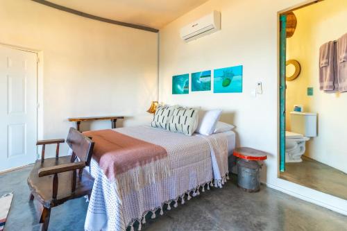 a bedroom with a bed and a mirror at Pacific Villa Punta Mita-Playa Careyeros in Punta Mita