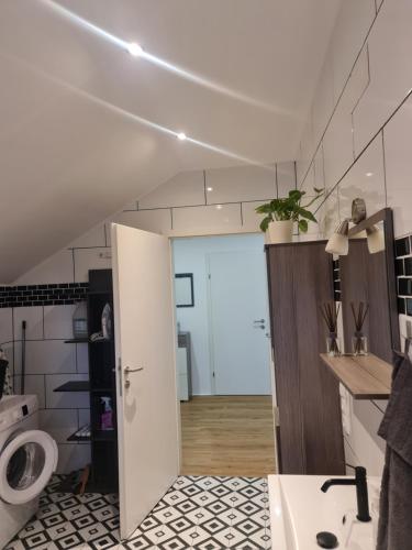 a bathroom with a sink and a toilet in a room at Ferienwohnung Traisen Has in Traisen