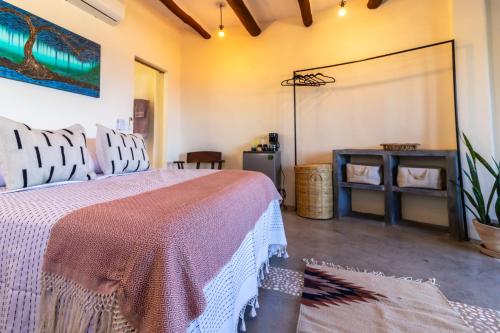 a bedroom with a large bed and a screen at Pacific Villa Punta Mita-Playa Careyeros in Punta Mita