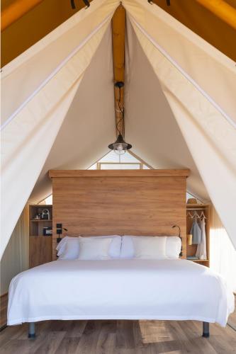 a bedroom with a bed in a tent at Wecamp San Sebastián in San Sebastián