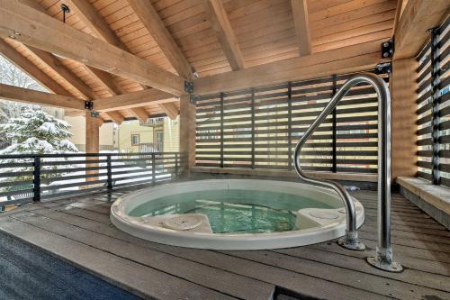 a jacuzzi tub on a wooden deck at Mtn-View Condo about 3 Mi to Dtwn Steamboat Springs! in Steamboat Springs