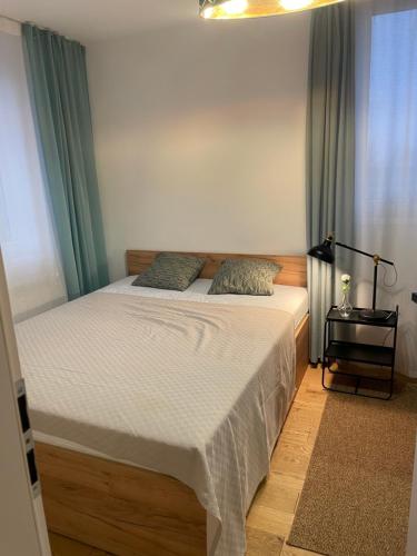 Posteľ alebo postele v izbe v ubytovaní PM RESIDENCE KORFANTEGO 8