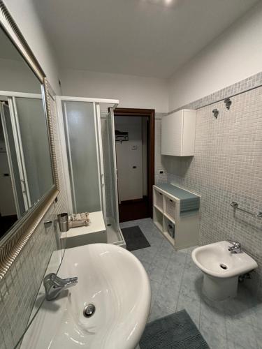 a bathroom with a sink and a toilet at Michelangelo Apartment Pescara in Pescara
