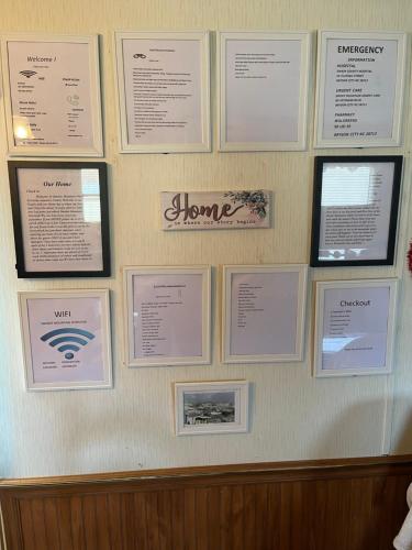 a wall with certificates andaques on a wall at Smokey Mountain Overlook in Bryson City