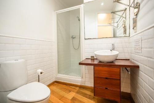 a bathroom with a toilet and a sink and a shower at En2val1028 - Eixample Esquerra with terrace in Barcelona