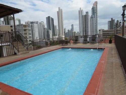 a large swimming pool on the roof of a building at Hotel Costa Inn in Panama City