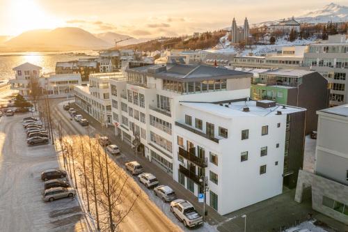 an aerial view of a city with buildings and cars at Luxury stylish apartment central Akureyri in Akureyri
