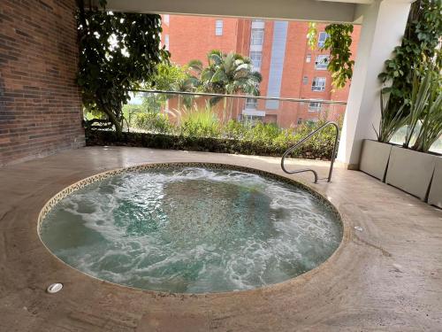 a hot tub in the middle of a courtyard at Cozy Oasis with Panoramic Views in Cerritos