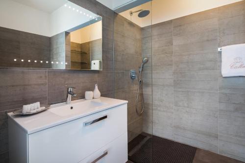 a bathroom with a sink and a shower at Jasmin in Posedarje