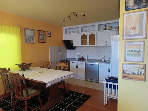 a kitchen with a table and a dining room at Park in Lazarevac