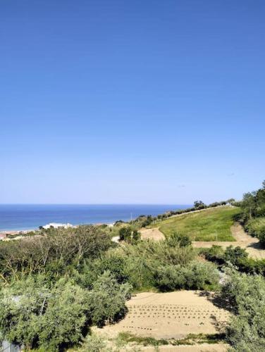 a view of a beach with the ocean in the background at Casa Green in Silvi Marina