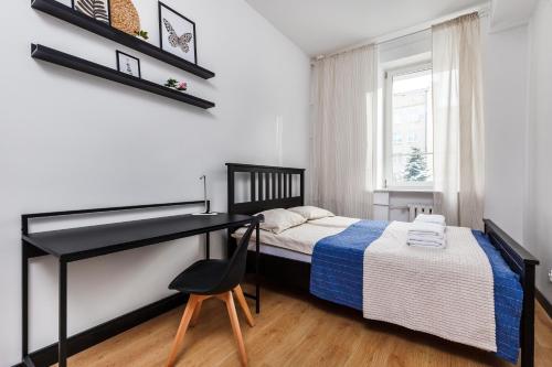 Giường trong phòng chung tại Prime Home CENTRUM 2