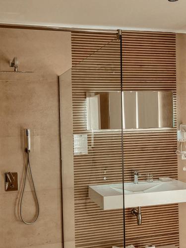 a bathroom with a sink and a shower at Maxi Room in Vlorë