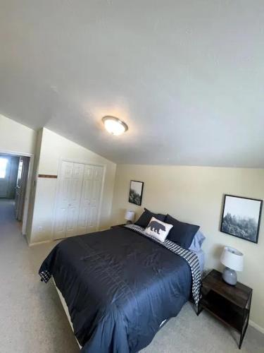 a bedroom with a large bed in a room at Yellowstone Adventures in Island Park