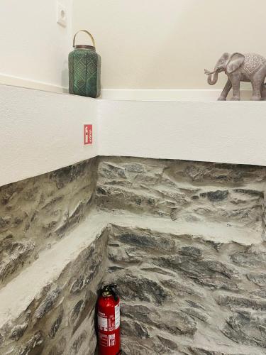 a can of soda sitting on a shelf in a bathroom at Cozy House in Funchal