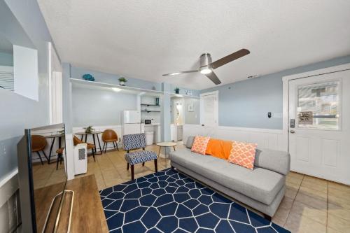a living room with a couch and a table at Pure Paradise Kure Beach, Ocean front, Pool coming soon! in Kure Beach