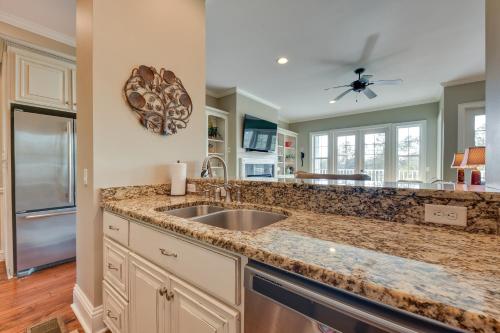 a kitchen with a sink and a counter top at St Marys Townhome with Community Hot Tub and Boat Dock in Saint Marys