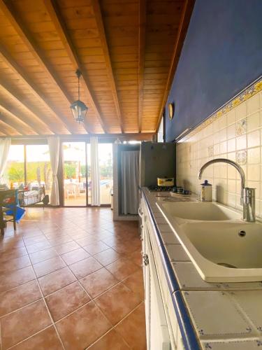 a kitchen with a sink and a counter top at Villa Verabetta in San Vito lo Capo