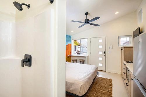 a room with a door with a ceiling fan at Downtown Kokopelli West 5 - Newly Remodeled Stylish Studio in Moab