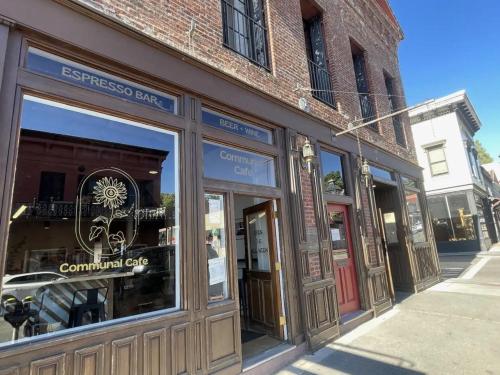 a store front with glass windows on a street at Speakeasy Queen Suite (Rm 7) in Nevada City