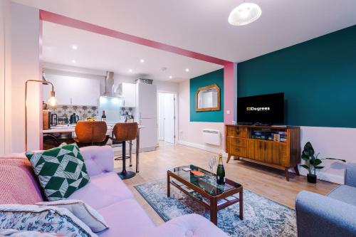 a living room with a couch and a tv at NEW! Stunning City-Centre Home by 53 Degrees Property, ideal for Couples, Amazing Location! in Chester