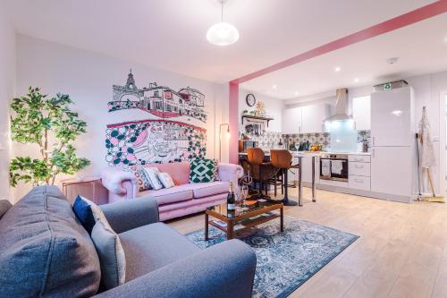 a living room with a couch and a kitchen at NEW! Stunning City-Centre Home by 53 Degrees Property, ideal for Couples, Amazing Location! in Chester