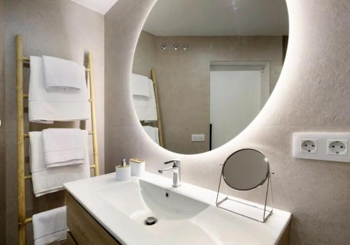a bathroom with a sink and a mirror at Luxury Loft Mar y Sol 1 in Tacoronte