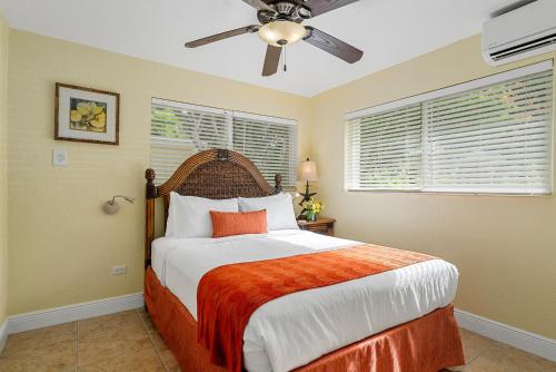 a bedroom with a bed and a ceiling fan at Bay Harbor Lodge in Key Largo