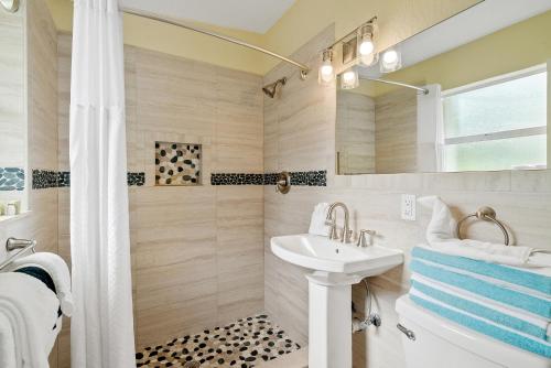 a bathroom with a sink and a shower at Bay Harbor Lodge in Key Largo